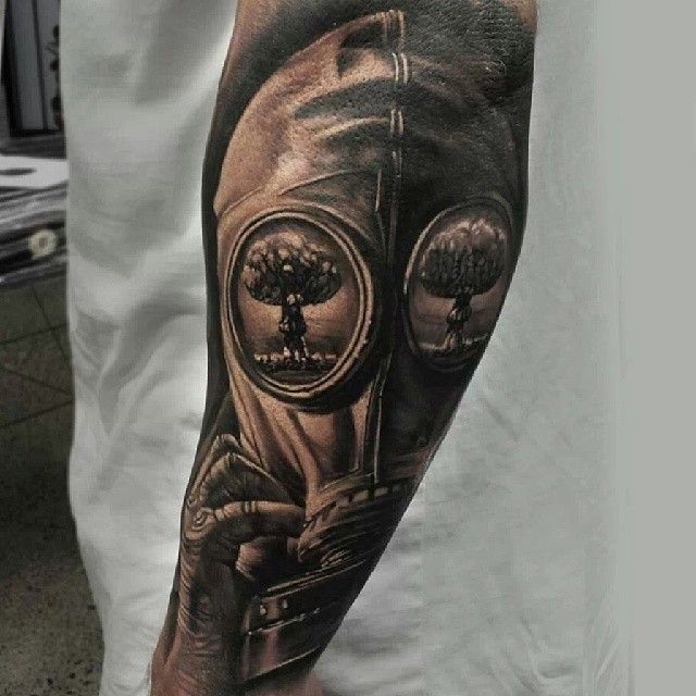 Realistic Grey Ink Gas Mask Tattoo On Left Sleeve