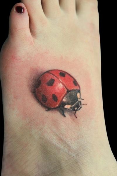 Realistic Ladybug Tattoo On Girl Left Foot