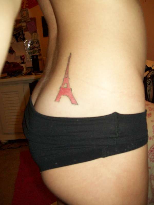 Red Eiffel Tower Tattoo On Girl Lower Back