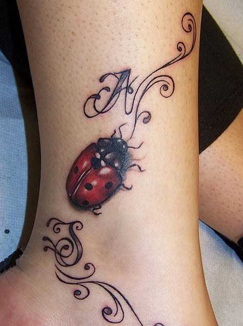Red Ink Ladybug Tattoo On Side Leg