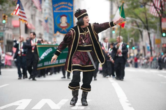 A Reveller Performing During The Columbus Day Parade