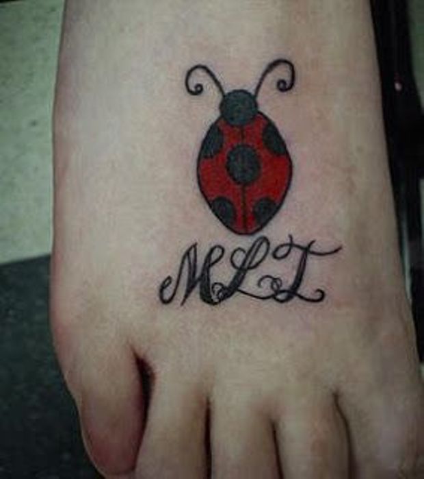 Right Foot Black And Red Ladybug Tattoo
