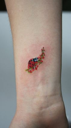 Right Wrist Ladybug Tattoo