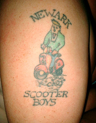 Scooter Boys Tattoo On Right Shoulder
