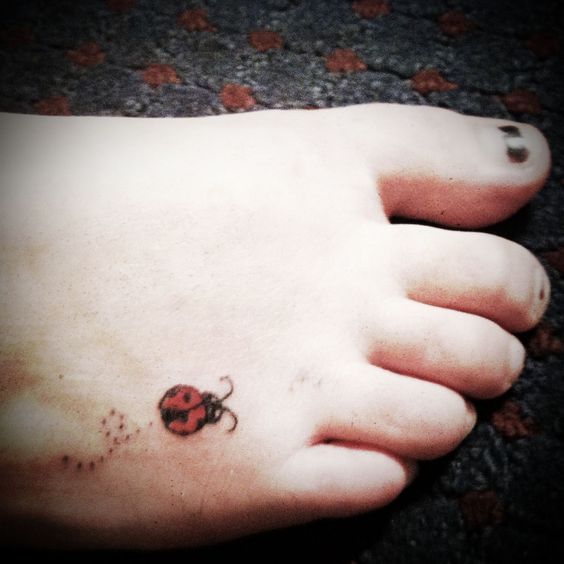 Small Ladybug Tattoo On Right Foot