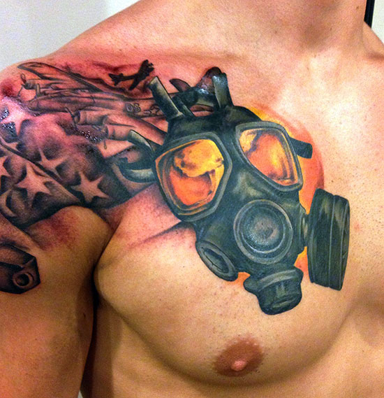 Stars And Gas Mask Tattoo On Man Front Shoulder