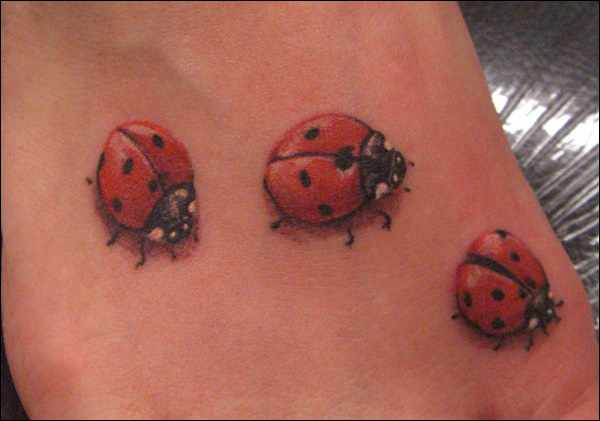 Three Ladybug Tattoos On Foot