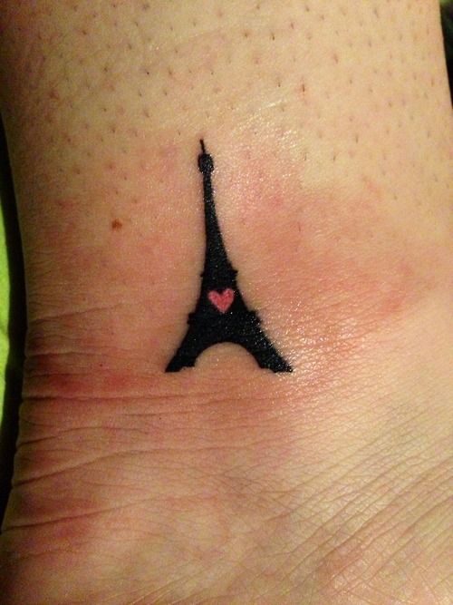 Tiny Pink Heart In Black Eiffel Tower Tattoo On Ankle