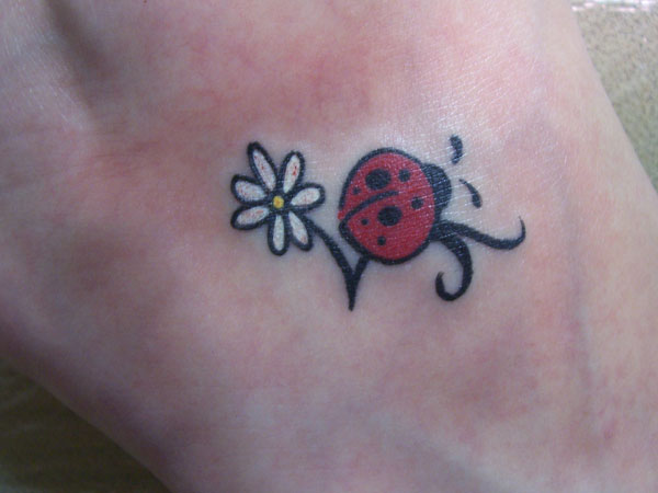 White Flower And Red Ladybug Tattoo