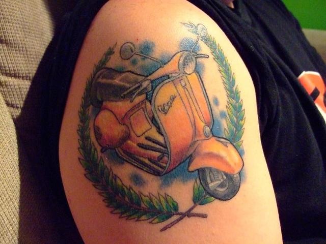 Yellow Scooter Tattoo On Right Shoulder