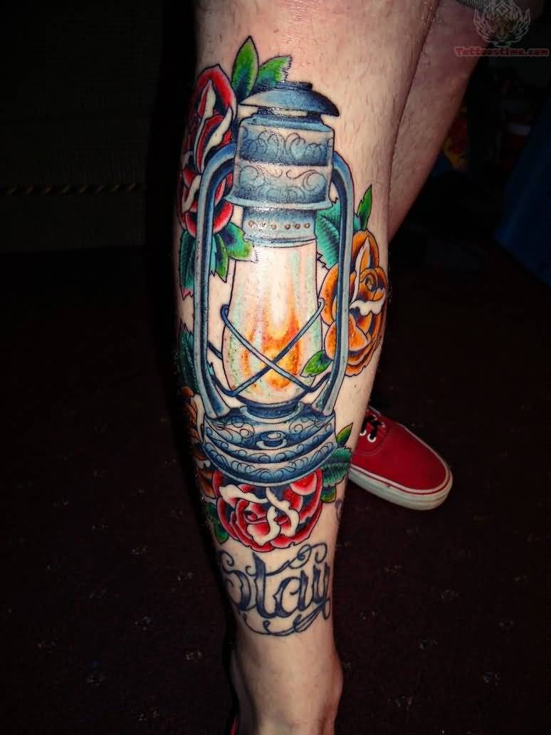 Amazing Color Rose Flowers And Lamp Tattoo On Leg