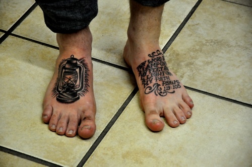 Black And Grey Lamp Tattoo On Foot