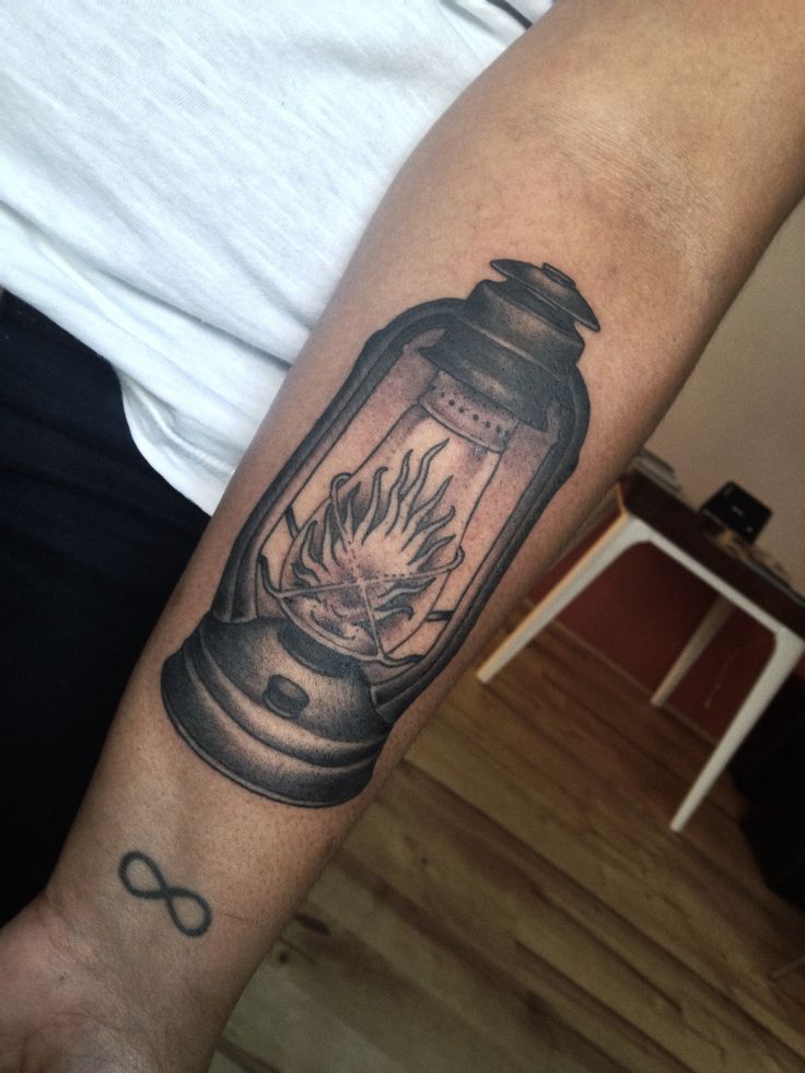Black And Grey Oil Lamp Tattoo On Forearm
