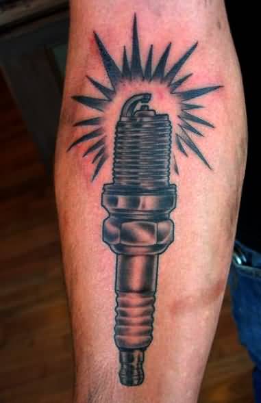 Black And Grey Spark Plug Tattoo On Forearm