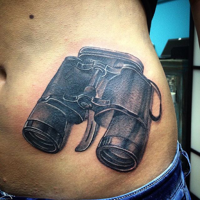 Black Ink Binoculars Tattoo On Left Hip
