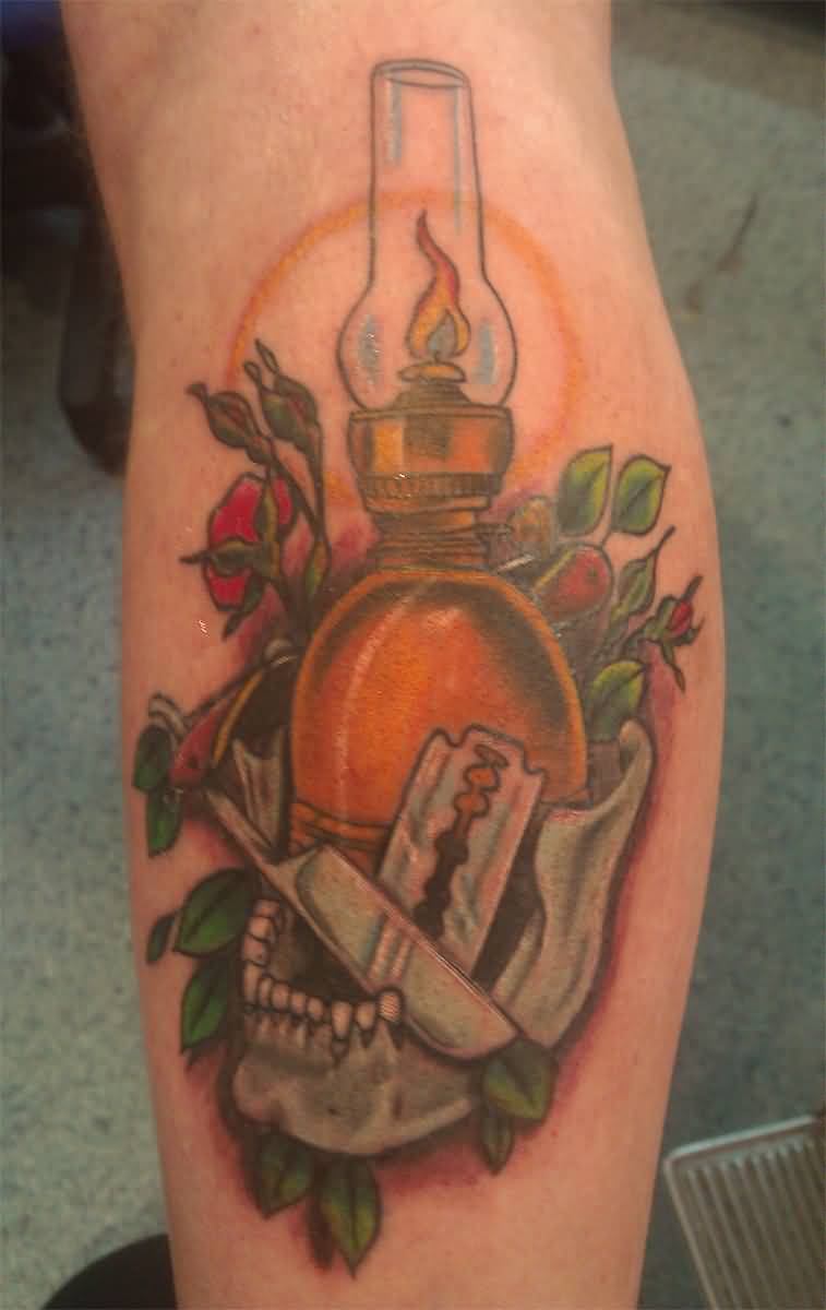 Blades And Oil Lamp Tattoo On Leg