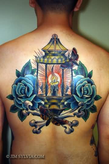Blue Rose And Lamp Tattoo On Man Upper Back
