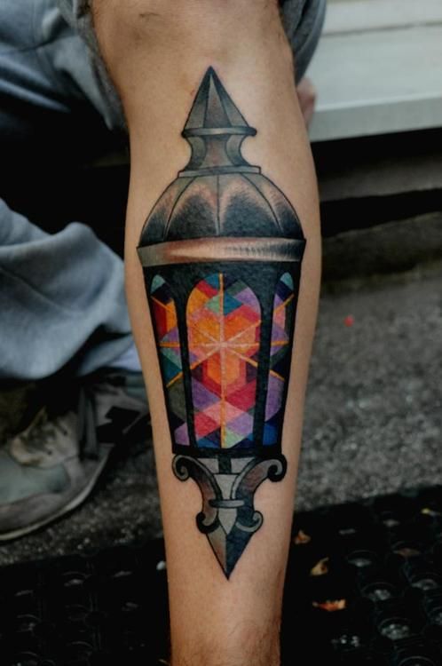 Colored Lamp Tattoo On Left Leg