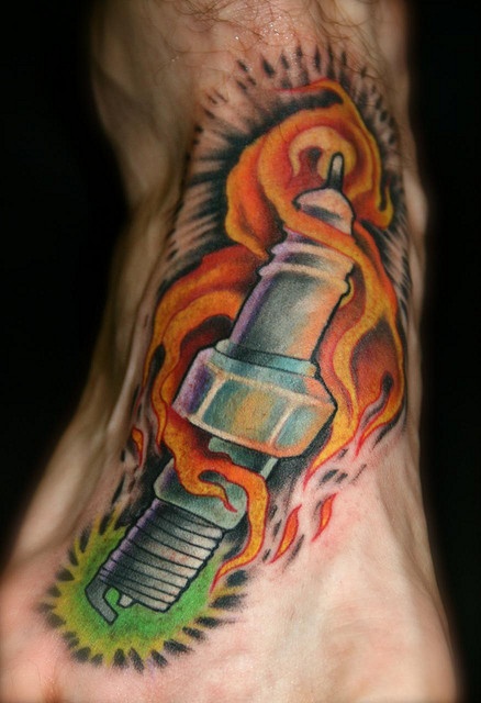 Colored Spark Plug Tattoo On Right Foot
