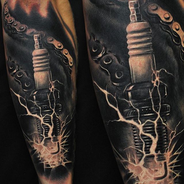 Dark Ink Spark Plug Tattoo On Sleeve
