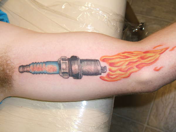Flaming Spark Plug Tattoo On Inner Bicep
