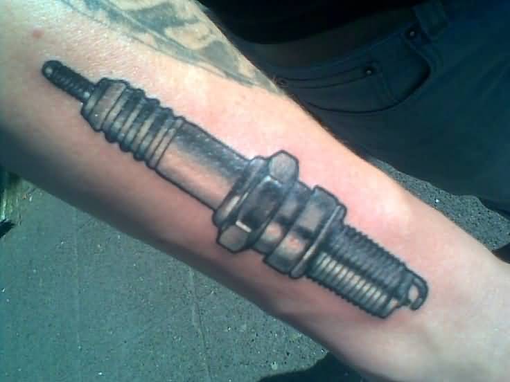 Grey And Black Spark Plug Tattoo On Forearm