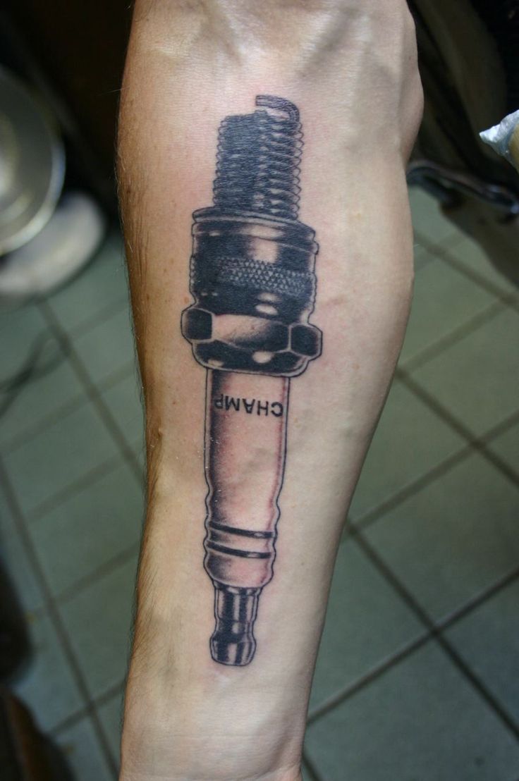 Grey Ink Spark Plug Tattoo On Right Forearm