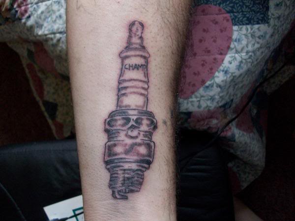 Grey Spark Plug Tattoo On Right Arm