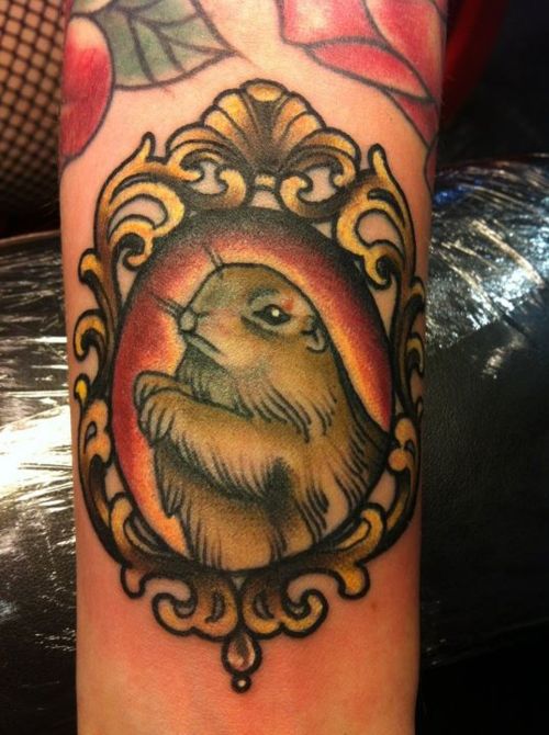 Hamster In Mirror Frame Tattoo On Bicep