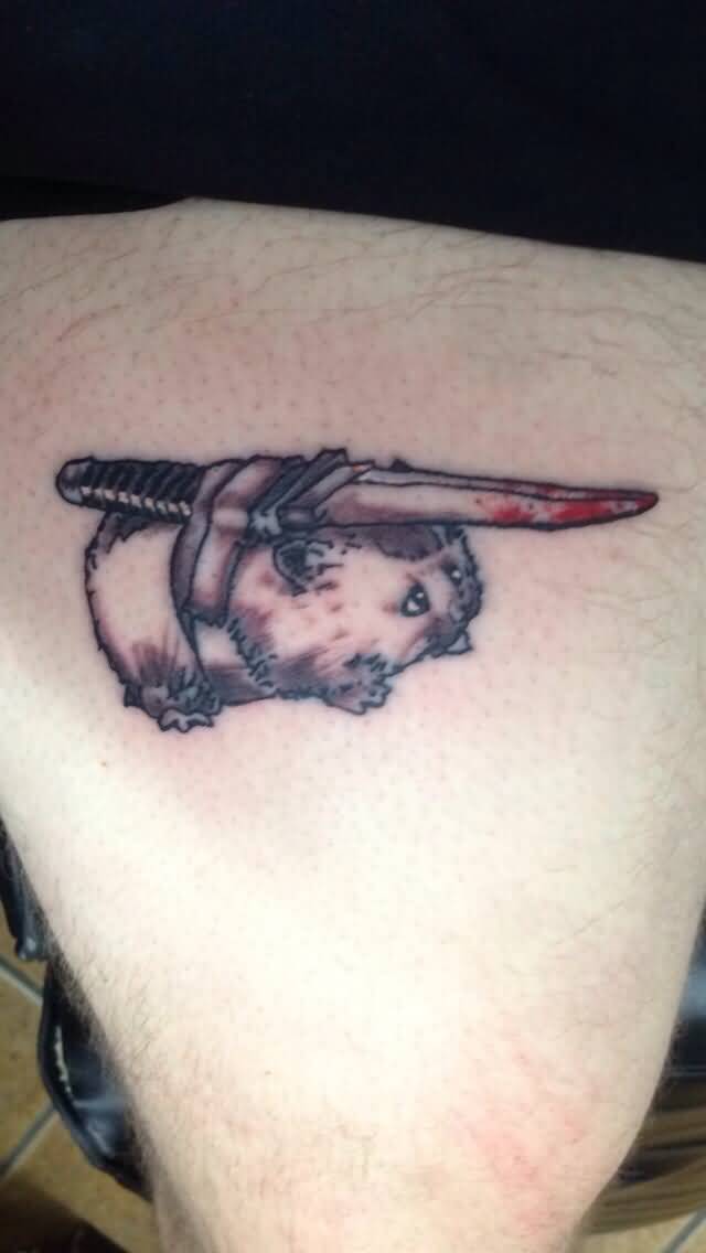 Hamster With Knife On Back Tattoo
