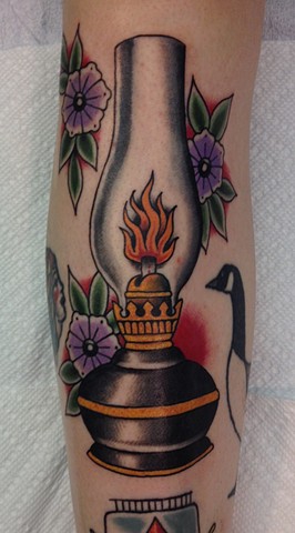 Purple Flowers And Oil Lamp Tattoo On Sleeve