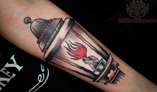 Red Flame Burning Candle Lamp Tattoo On Forearm