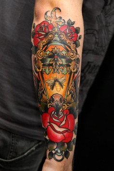 Red Rose Flower And Oil Lamp Tattoo On Arm