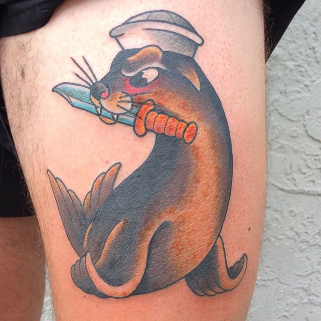 Seal With Knife In Hand Tattoo On Thigh