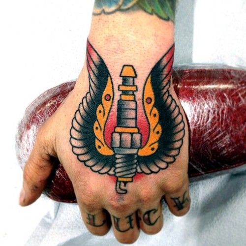 Traditional Winged Spark Plug Tattoo On Left Hand