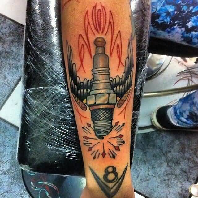 Winged Spark Plug Tattoo On Leg