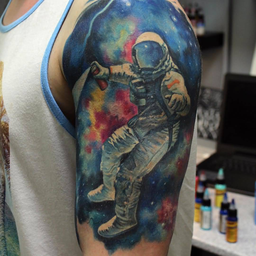Astronaut In Space Tattoo On Guy Left Shoulder