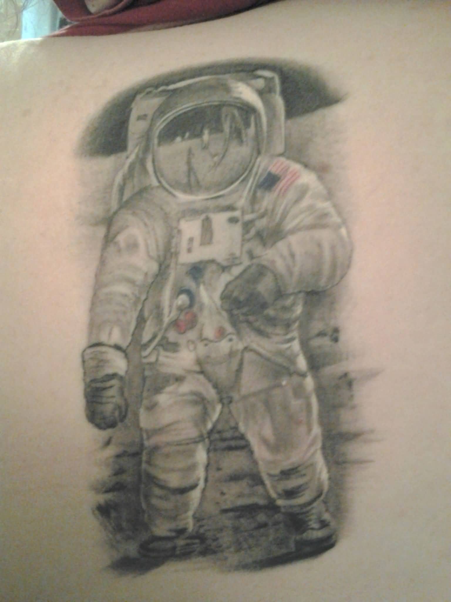 Black And White Astronaut Tattoo On Upper Back