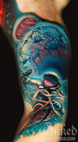 Colored Astronaut Tattoo On Inner Bicep