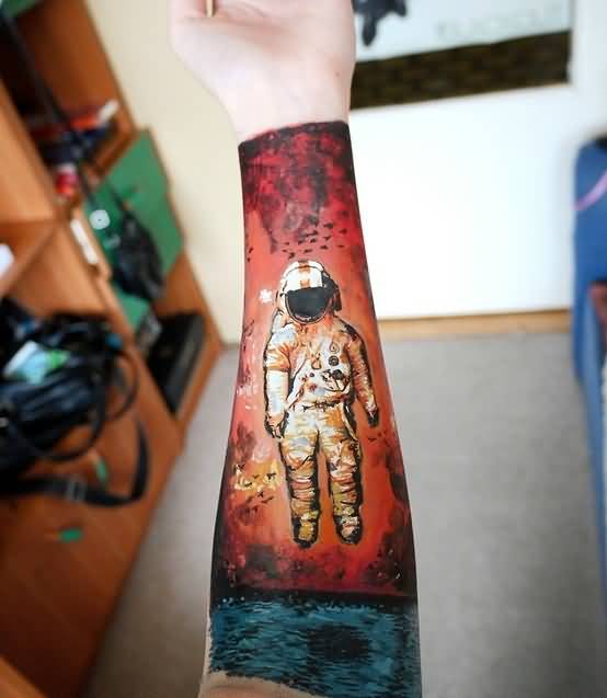 Colored Astronaut Tattoo On Left Forearm