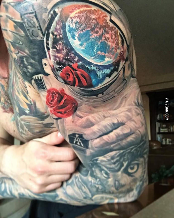 Colored Red Rose And Astronaut Tattoo On Left Sleeve