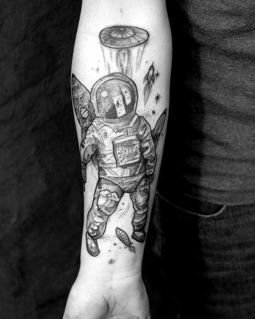 Grey Ink Astronaut Tattoo On Right Forearm by Martynas Šnioka