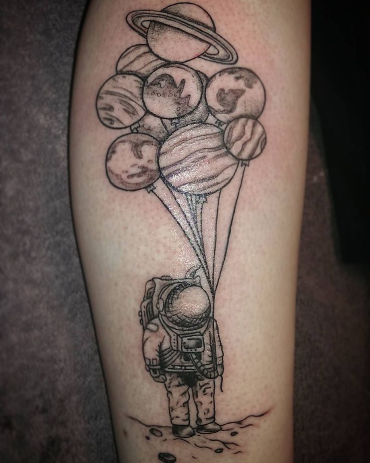 Grey Ink Astronaut With Planet Balloons Tattoo On Leg