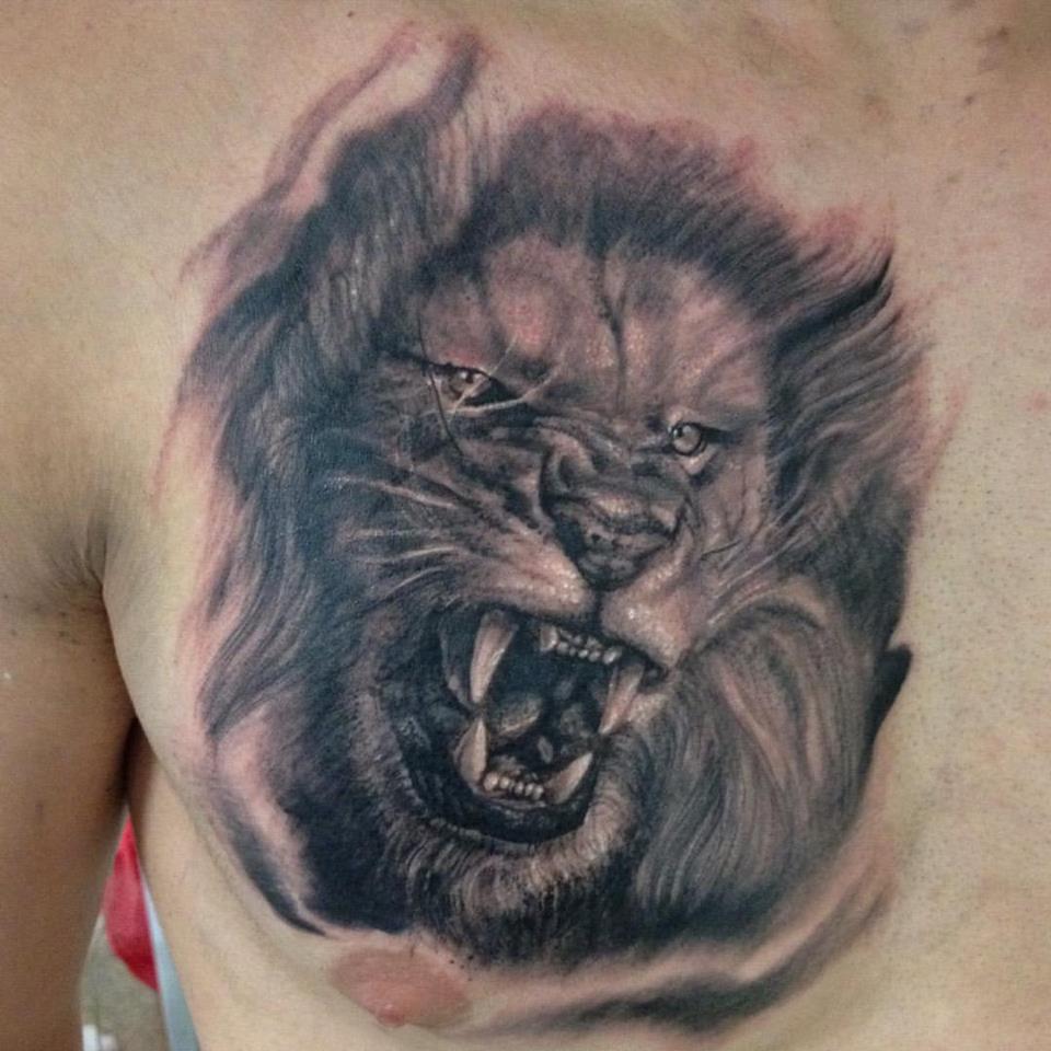 Grey Ink Roaring Lion Head Tattoo On Chest by Grey Wagner