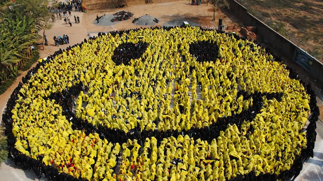 Large Number Of People Making Smiley Celebrating World Smile Day