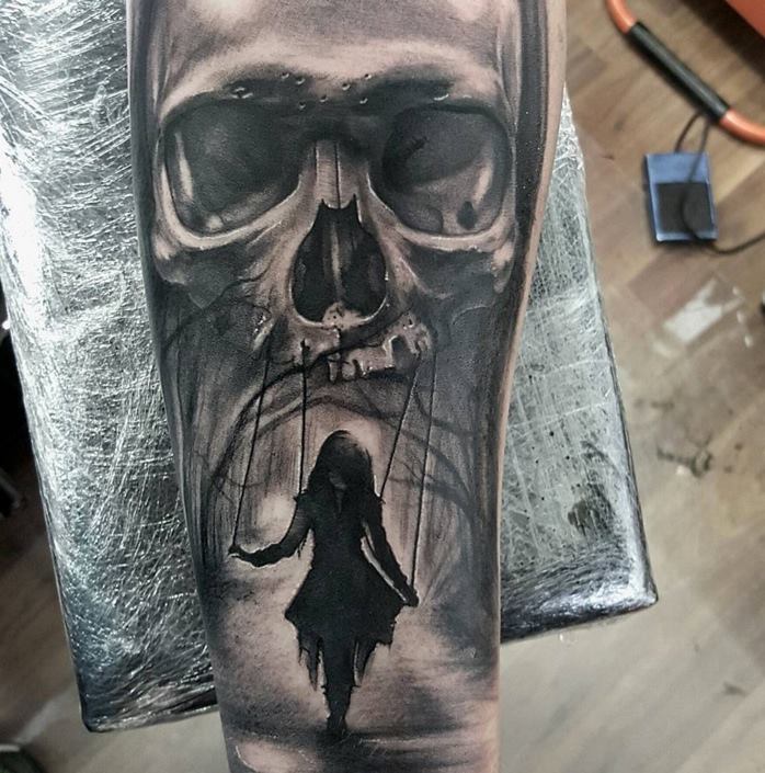 Realistic Skull And Swinging Girl Tattoo On Forearm by Luke Sayer