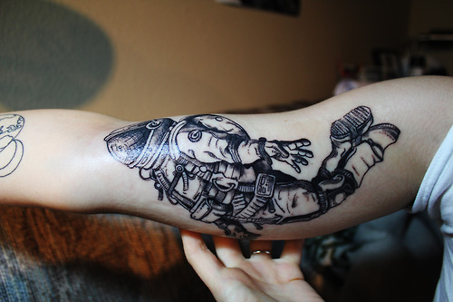 Right Bicep Grey Ink Astronaut Tattoo