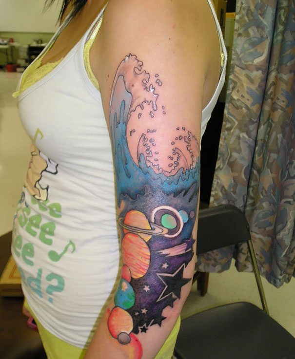 Stars And Space Tattoo On Girl Left Sleeve