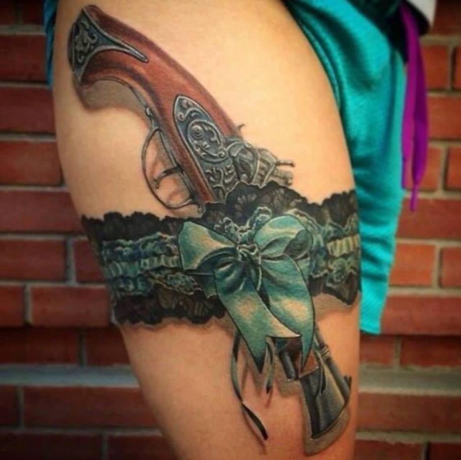 Traditional Gun And Lace Garter Tattoo On Right Thigh