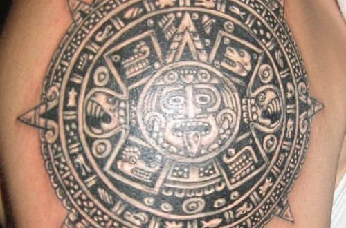 Black And Grey Aztec Mayan Sun Tattoo On Shoulder